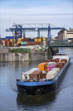 Container freighter Aarburg, leaving the container terminal in Frankfurt Osthafen, belonging to