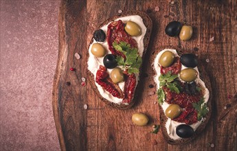 Breakfast, sandwiches, with cream cheese, olives, top view