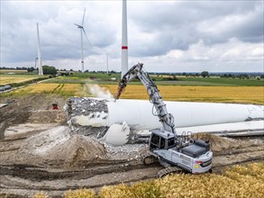 Demolished tower of a 20 year old wind turbine, in the Werl wind farm, 5 old Enercon E-66 turbines