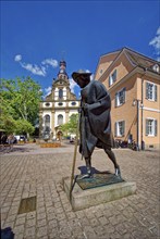 Statue of St James pilgrim and Holy Trinity Church at Geschirrplätzel, Speyer,