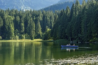 Spitzingsee, family excursion in an electric boat on the mountain lake, municipality of Schliersee,