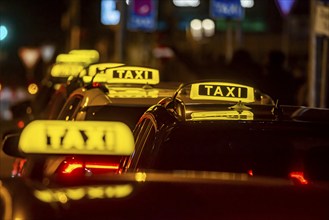 Illuminated taxi sign in the evening, symbolic photo, Stuttgart, Baden-Württemberg, Germany, Europe