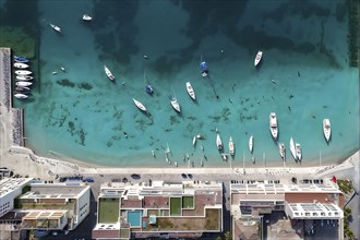 Aerial view of an idyllic harbor landscape with sailboats and yachts, AI generated