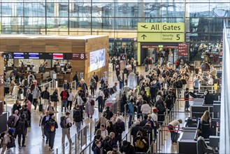 Berlin-Brandenburg BER Airport. Passengers in Terminal 1 waiting for check-in and security control