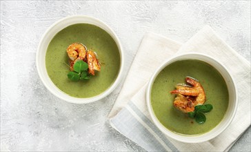 Pea cream soup, with shrimp, green soup, homemade, top view, no people