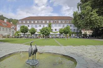 Heron fountain with two bird figures, park and building Bad Hotel, Badgarten, sculptures, heron,