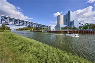 Datteln 4 coal-fired power station and Dortmund-Ems Canal with motorboat in Datteln, Ruhr area,