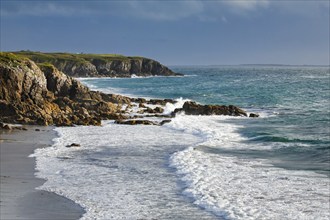 Waves breaking on the rocky coast near Plouarzel on the Atlantic coast, Département Finistère,