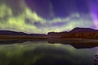 Northern lights, aurora borealis, reflected in lake, mountains, autumn, autumn colours,