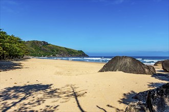 Remote Bonete beach surrounded by hills and forests on Ilhabela island in Sao Paulo coast