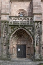 Main entrance portal of St Nicholas and St Ulrich Church, nave built around 1400, Kirchenberg 15,