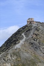 View of small hotel accommodation Rifugio Garibaldi above east ramp north ramp ascent from to 2757