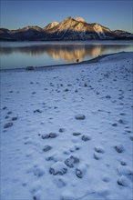 Sunrise over mountain lake, reflection, winter, Walchensee, view of Herzogstand and Heimgarten,