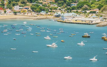 A beautiful bay with yachts and boats on the shore. Boats and yachts in the bay of San Juan del Sur