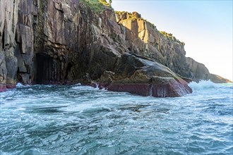 Cliff over the sea on the island of Ilhabela in Sao Paulo, Ilhabela, Sao Paulo, Brazil, South