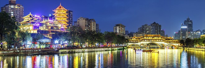 Chengdu Anshun Bridge over Jin River with pagoda panorama at night in Chengdu, China, Asia