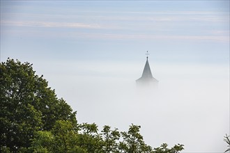 Church spire church spire rises out of dense fog dense fog bank, Germany, Europe