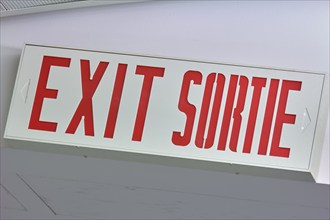 A sign with the inscription 'EXIT SORTIE' in red, Toronto Airport, Ontario, Canada, North America