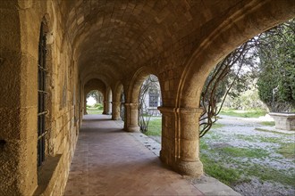 Monastery of Our Lady of Mount Filerimos, Historic stone portico with views of the surrounding