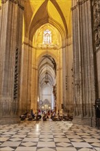 Towering Gothic church with impressive columns and large windows, Seville