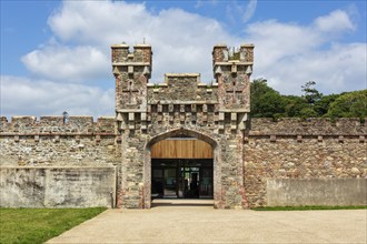 Historic castle with towers and stone walls, surrounded by trees and on a sunny day, Johnstown