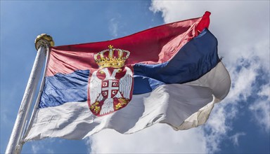 Flags, the national flag of Serbia flutters in the wind