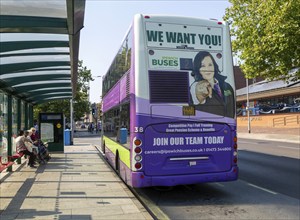 Advert on back of bus for staff vacancies, Ipswich Buses double decker, town centre of Ipswich,