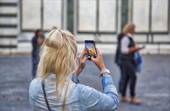 Florence, Italy-June 16, 2017: Tourist on the beautiful streets of Florence shooting landmark