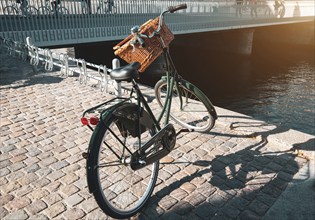 Bicycle parked near river canal in Copenhagen