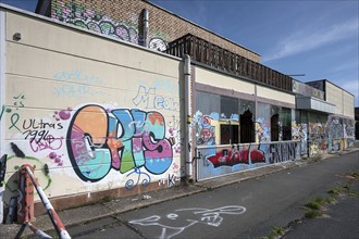 Graffiti on the building of an empty car dealership, Franconia, Bavaria, Germany, Europe