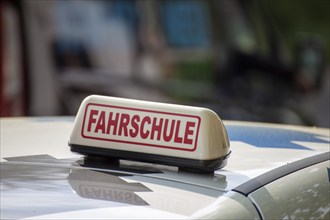 Close-up of a driving school sign in Germany