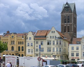 Market square with historic houses, in the background the remaining tower of St Mary's Church,