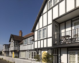 Historic clapperboard houses in village of Thorpeness, Suffolk, England, UK