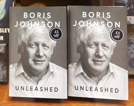 Boris Johnson 'Unleashed' book copies display in shop window, Ipswich, Suffolk, England, UK