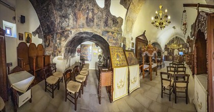 Panoramic view of the interior of the two-nave monastery church dedicated to the Assumption of the