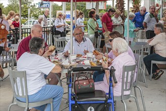 Senior customers eating at the Chick-fil-a fast food restaurant in Ocala, Florida, USA, North