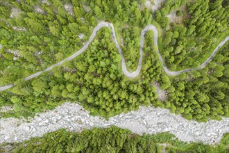 Aerial view, drone shot, windy road along a river, mountain valley, Switzerland, Europe