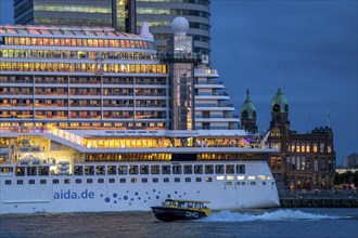 Cruise ship Aida Prima at the Cruise Terminal of Rotterdam, Kop van Zuid, skyscrapers at the