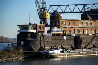 Old harbour buildings at Krefeld Rhine harbour, cargo ship on the Rhine, Krefeld, North