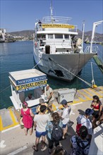 The village of Agios Nikolaos, in the eastern part of Crete, excursion boat in the harbour, Nostos