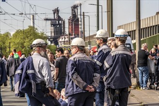 Steelworkers at a demonstration in front of the headquarters of ThyssenKrupp Steel Europe in