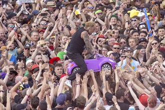 Adenau, Germany, 8 June 2024: Ingo Knollmann from the Donots crowdsurfing at Rock am Ring. The