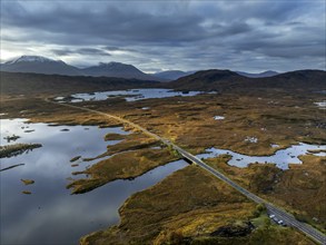 Morning light, cloudy mood, sunbeams, loch, moor, mountain landscape, aerial view, road, autumn,