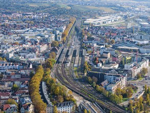 Stuttgart Bad Cannstatt with railway station, aerial view. Above it the Mercedes-Benz engine plant