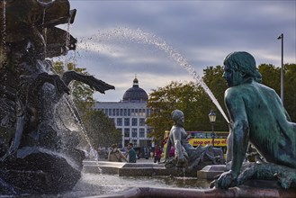 Water fountain of the Neptune Fountain backlit with Berlin Cathedral, Spandauer Straße, Berlin,