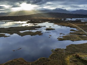 Morning light, cloudy mood, sunbeams, loch, moor, mountain landscape, aerial view, road, autumn,