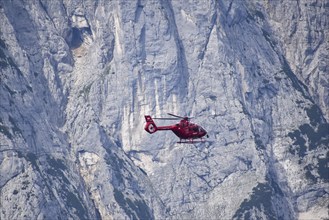 Airbus H135 helicopter in use as a rescue helicopter for the emergency doctor and the mountain