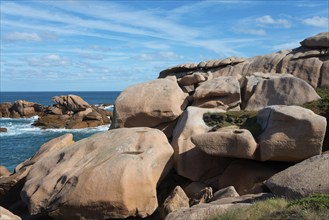 Rock formations on a coastline under a blue sky, Ploumanac'h, Ploumanach, Perros-Guirec,