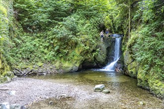 Teenagers swimming at the Geroldsau waterfall, Geroldsau, Baden-Baden, Baden-Württemberg, Germany,