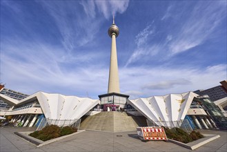 Berlin television tower with stairs against blue sky with cirrostratus clouds, Panoramastraße,